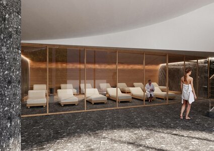 A modern spa area featuring a glass-enclosed relaxation room with several white lounge chairs. One person sits in a chair while another walks in wearing a bathrobe. The floor is dark stone, and the walls have a warm wooden finish, creating a serene atmosphere.