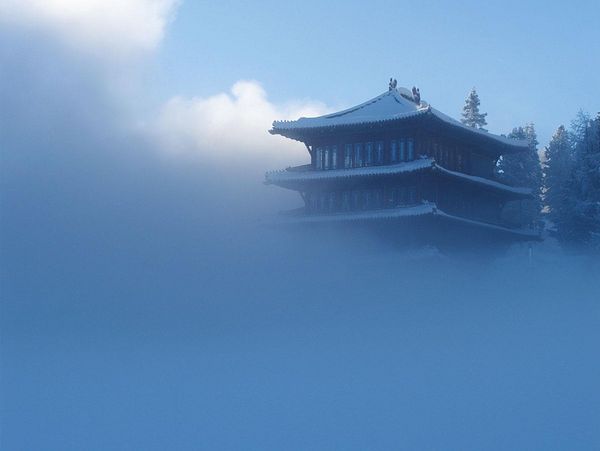 The Chinaturm rises with its 4 storeys from a thick foggy sky