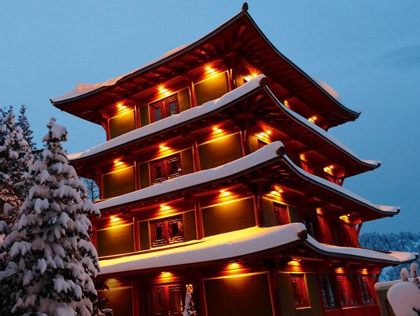 The illuminated Chinatower in winter from the outside in the Hotel Hochschober