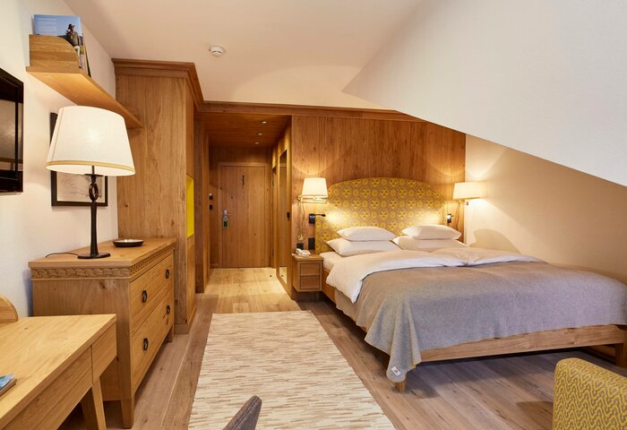 Classic studio in Hotel Hochschober A classic studio room with a double bed, wooden furniture and warm neutral tones.